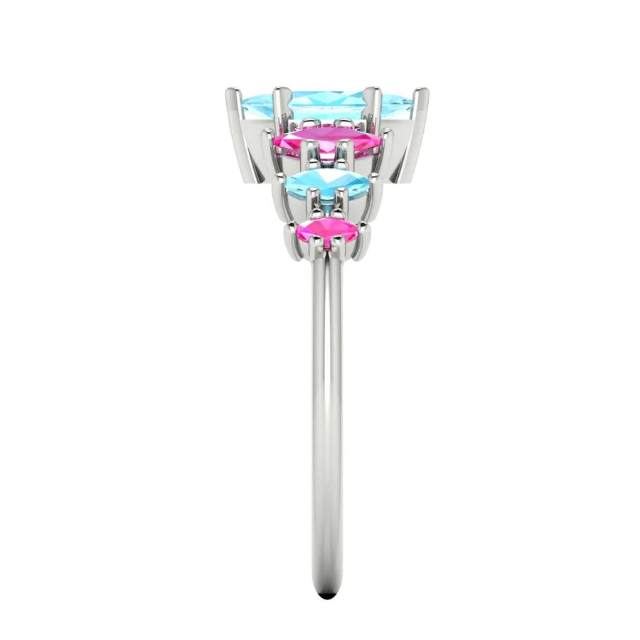 Harlequin gemstone ring with a central aquamarine and pink sapphire accents - side view