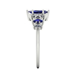 Harlequin seven-stone ring with blue sapphires and marquise diamonds in a white metal setting - side