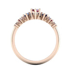 Profile view of the Harlequin ruby and blue sapphire ring, showing its raised open claw settings and polished 18ct rose gold band.