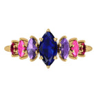Seven marquise sapphires and rubies arranged across the Harlequin yellow gold ring