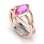 Infinity marquise pink sapphire ring in 18ct rose gold, profile view showing the sculptural wrap-around band, alternative engagement ring handmade in our London studio