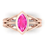 Infinity marquise pink sapphire ring in 18ct rose gold, overhead view showing the vivid pink sapphire set in the continuous wrap band, handmade in London