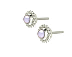 An angled perspective of the Silver Mini Alto earrings, highlighting the three-dimensional, architectural silver mounting and the soft sheen of the ivory pearl.