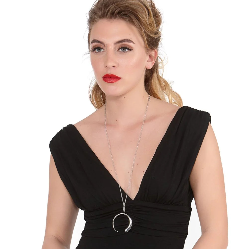 Large Luna Statement Pendant in sterling silver — model wearing the large open crescent pendant on a fine chain