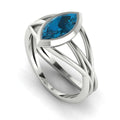 Infinity marquise London blue topaz ring in 18ct white gold, profile view showing the elegant elongated stone setting, handmade in our London studio