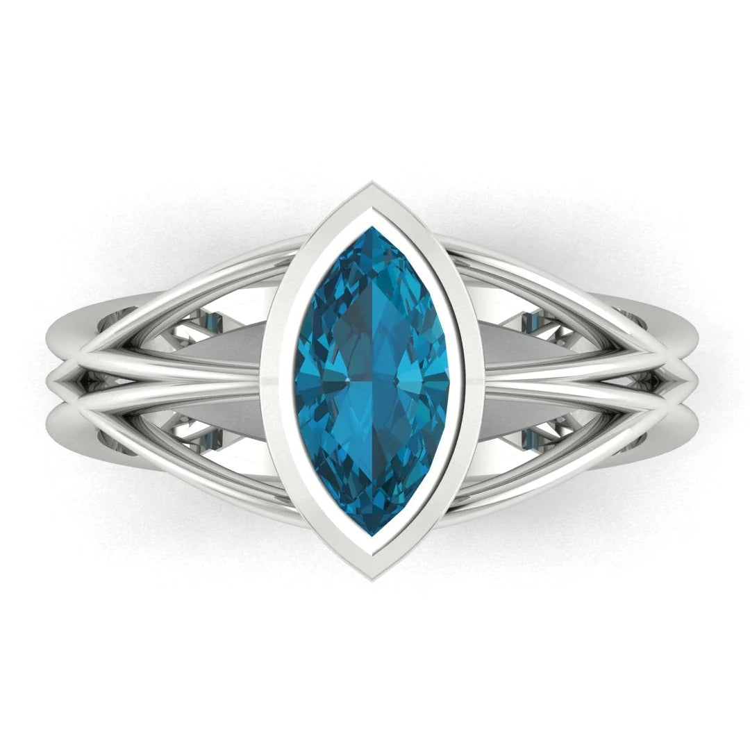 Infinity marquise London blue topaz ring in white gold or platinum, overhead view showing the deep inky blue of the marquise cut stone, handmade in London