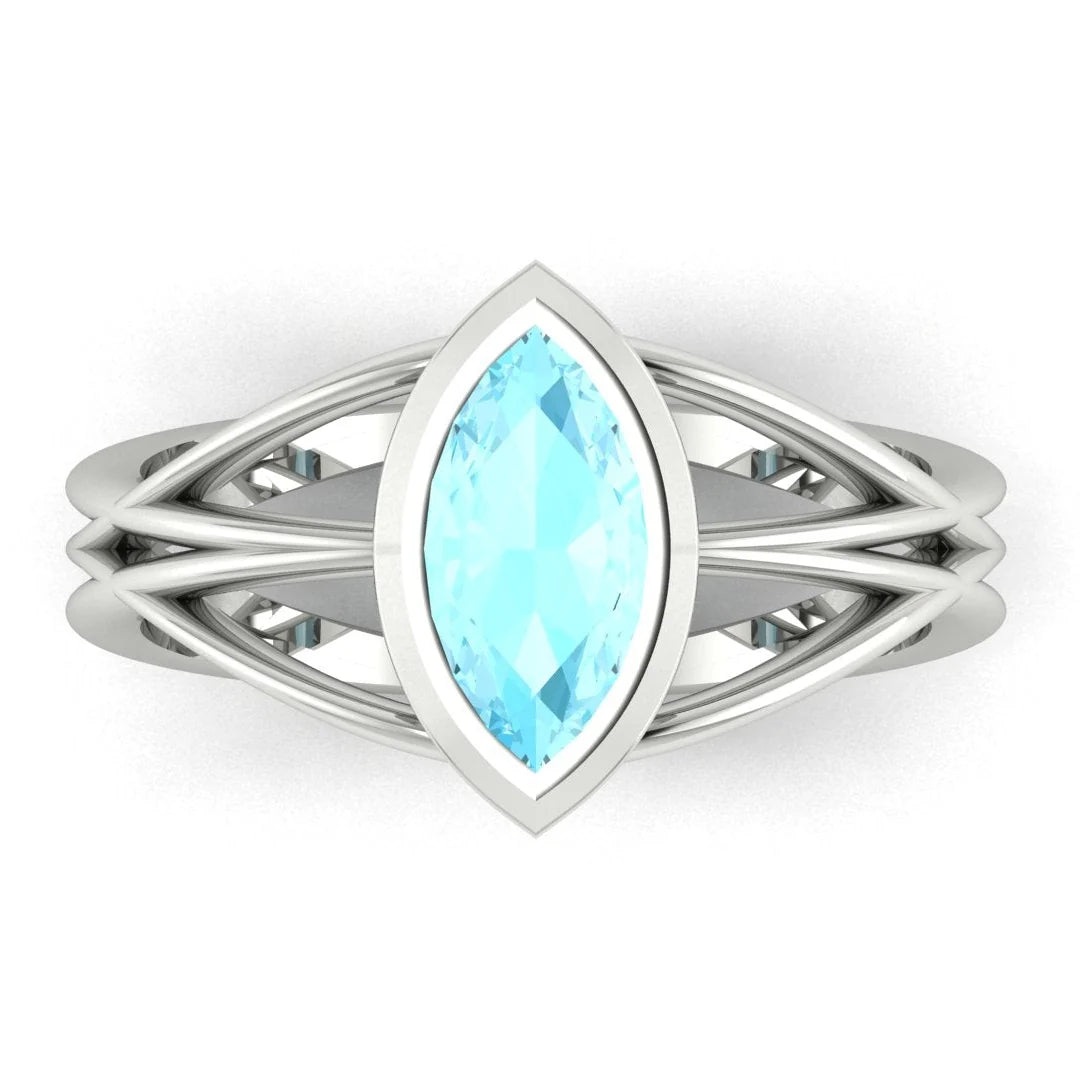 Infinity marquise aquamarine ring in white gold or platinum, overhead view showing the luminous marquise aquamarine set in the continuous wrap band, alternative engagement ring handmade in London