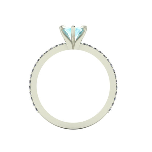 A through-finger view of the Amoret aquamarine ring showing the internal band and the clean, architectural setting symmetry.