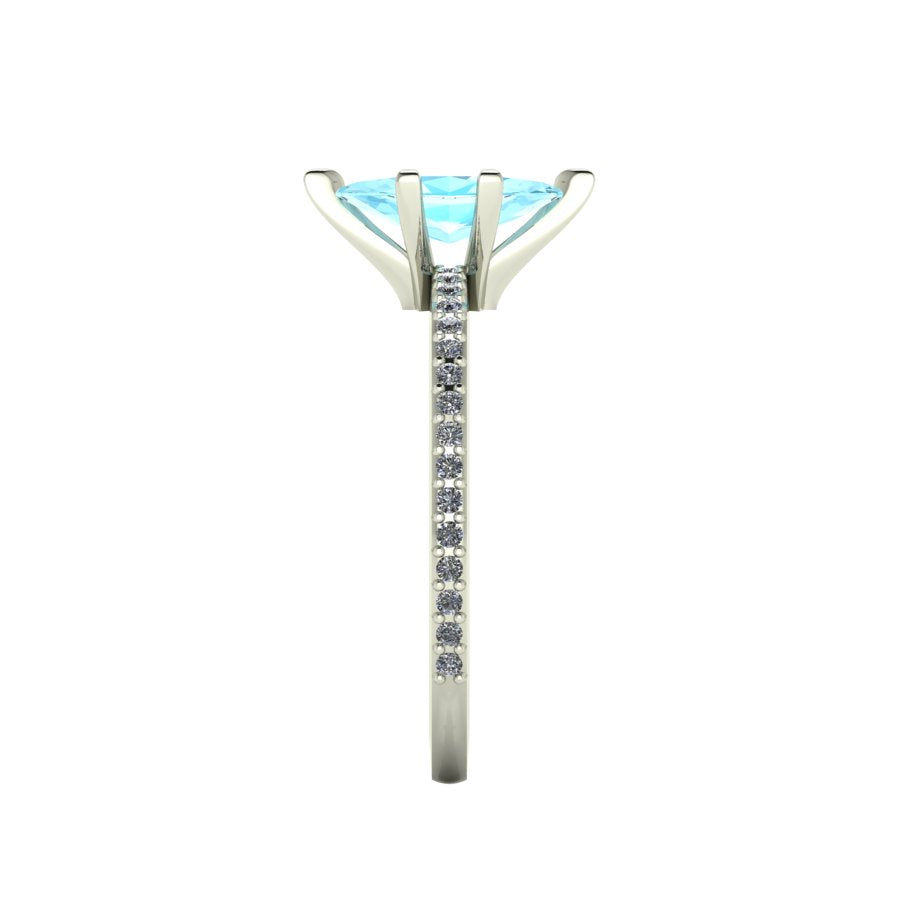 Close-up side view of the Amoret ring highlighting the secure claw setting for the aquamarine and the grain-set shoulder diamonds.