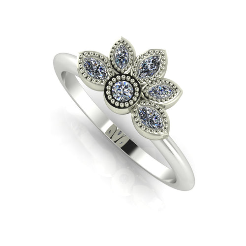 Angled view of an all-diamond cluster statement ring in white gold featuring delicate milgrain details and marquise stones.