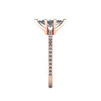 Close-up side view of the Amoret ring highlighting the secure claw setting for the marquise diamond and the grain-set shoulder stones.