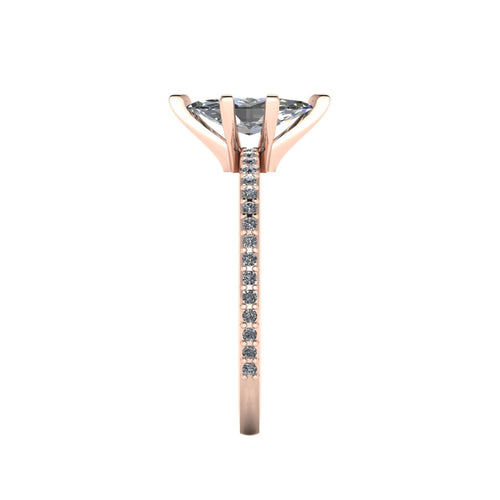 Close-up side view of the Amoret ring highlighting the secure claw setting for the marquise diamond and the grain-set shoulder stones.