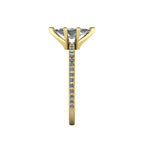 Close-up side view of the 18ct yellow gold Amoret ring highlighting the secure claw setting for the marquise diamond.