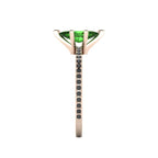 Close-up side view of the 18ct rose gold Amoret ring highlighting the secure claw setting for the tourmaline and black diamond-set shoulders.