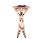 Infinity marquise ruby ring in 18ct rose gold, side profile showing the elegant low-set marquise ruby and sculptural band, handmade in our London studio