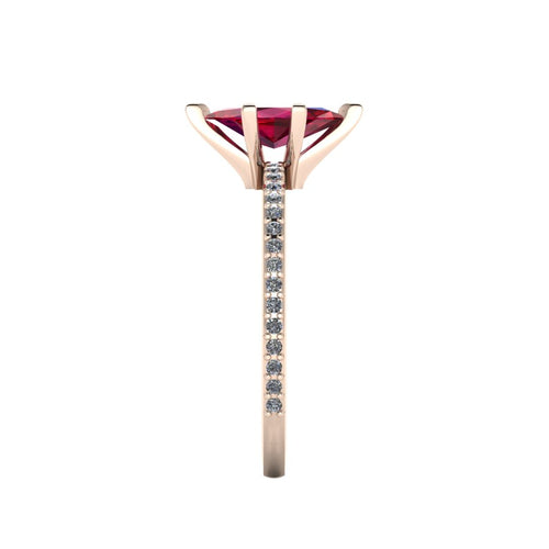Close-up side view of the 18ct rose gold Amoret ring highlighting the secure claw setting for the ruby and the grain-set shoulder diamonds.