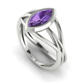 Infinity marquise violet sapphire ring in 18ct white gold, profile view showing the electric violet sapphire set in the sculptural wrap-around band, handmade in our London studio
