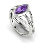 Infinity marquise violet sapphire ring in 18ct white gold, profile view showing the electric violet sapphire set in the sculptural wrap-around band, handmade in our London studio