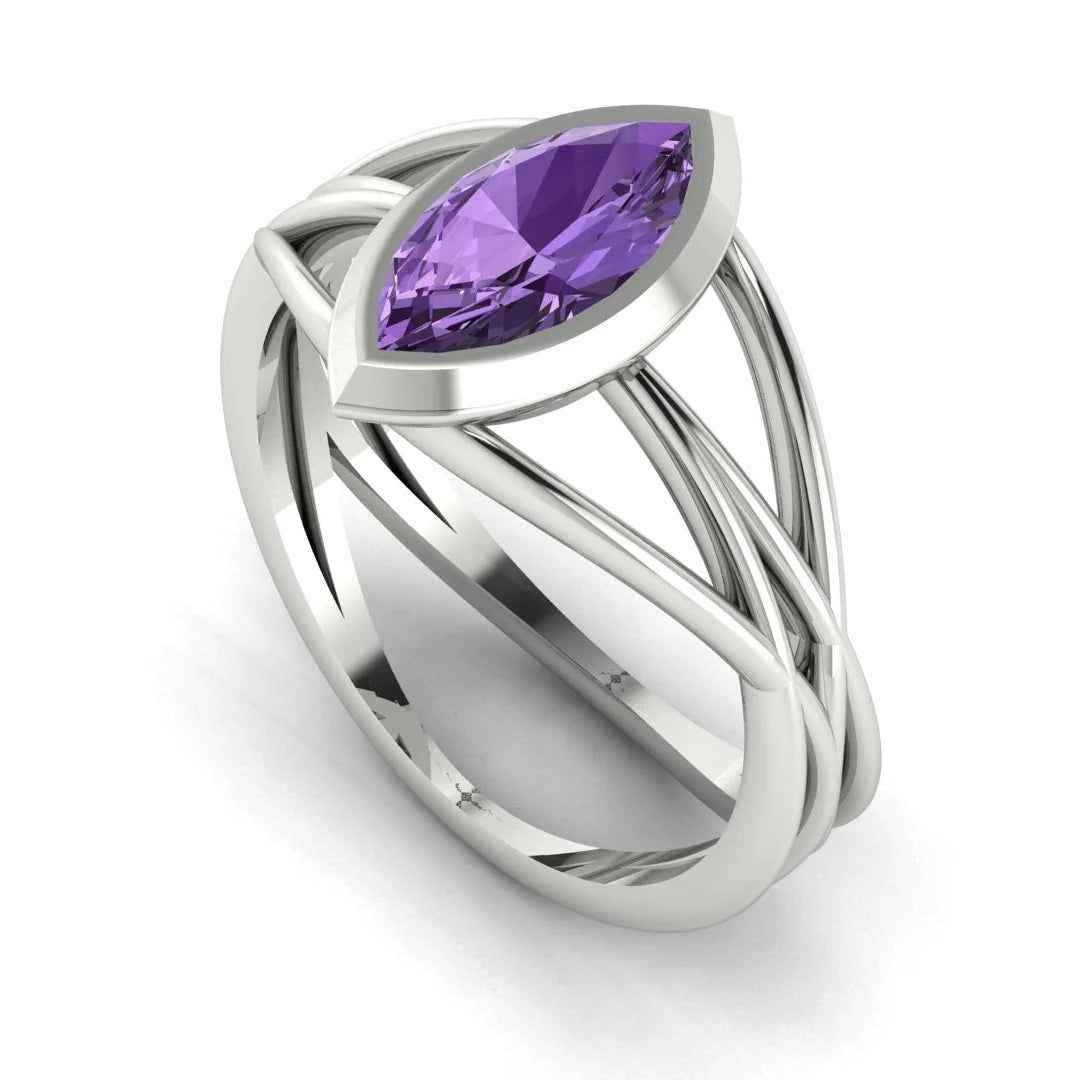 Infinity marquise violet sapphire ring in 18ct white gold, profile view showing the electric violet sapphire set in the sculptural wrap-around band, handmade in our London studio