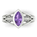 Infinity marquise violet sapphire ring in 18ct white gold, overhead view showing the vivid violet marquise sapphire in the continuous wrap band, alternative engagement ring handmade in London