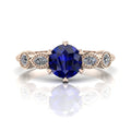 The Milena blue sapphire and rose gold ring, 6 claws and dainty diamonds.