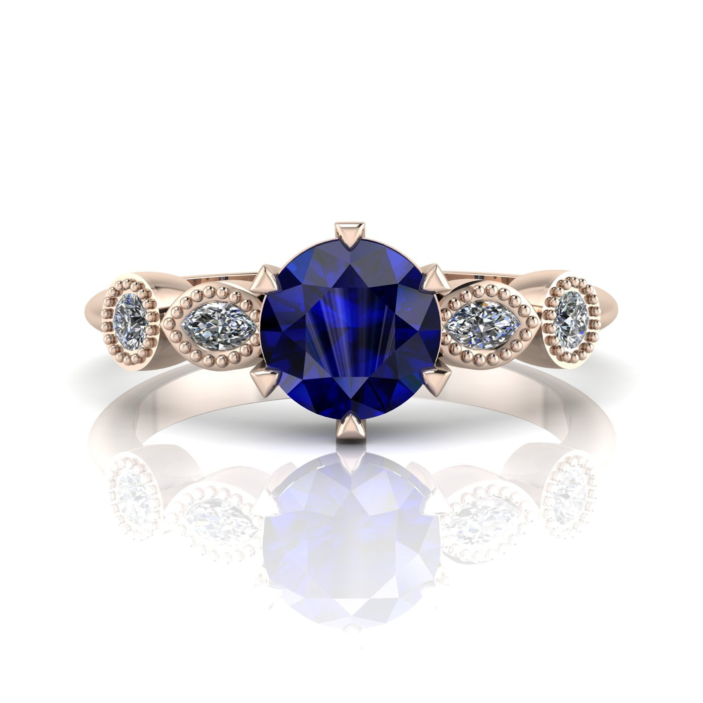 The Milena blue sapphire and rose gold ring, 6 claws and dainty diamonds.
