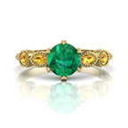 Milena five-stone engagement ring in 18ct recycled yellow gold with vivid emerald centre and yellow sapphire shoulders, by Nude Jewellery