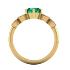 through finger view of the milena emerald engagement ring