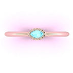 Top view of Mini Astraea 18ct rose gold ring featuring a horizontally set marquise-cut aquamarine.