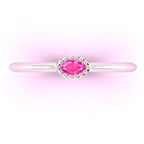 Overhead view of a dainty horizontal marquise pink sapphire ring in 18ct white gold.