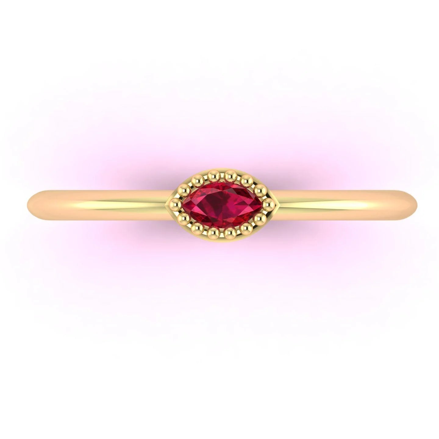 Top down view of a Mini Astraea ring featuring a horizontal marquise ruby set in a beaded 18ct yellow gold band.