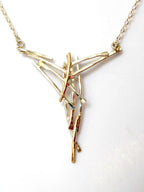 Close up of the Misu necklace - handmade silver and golg