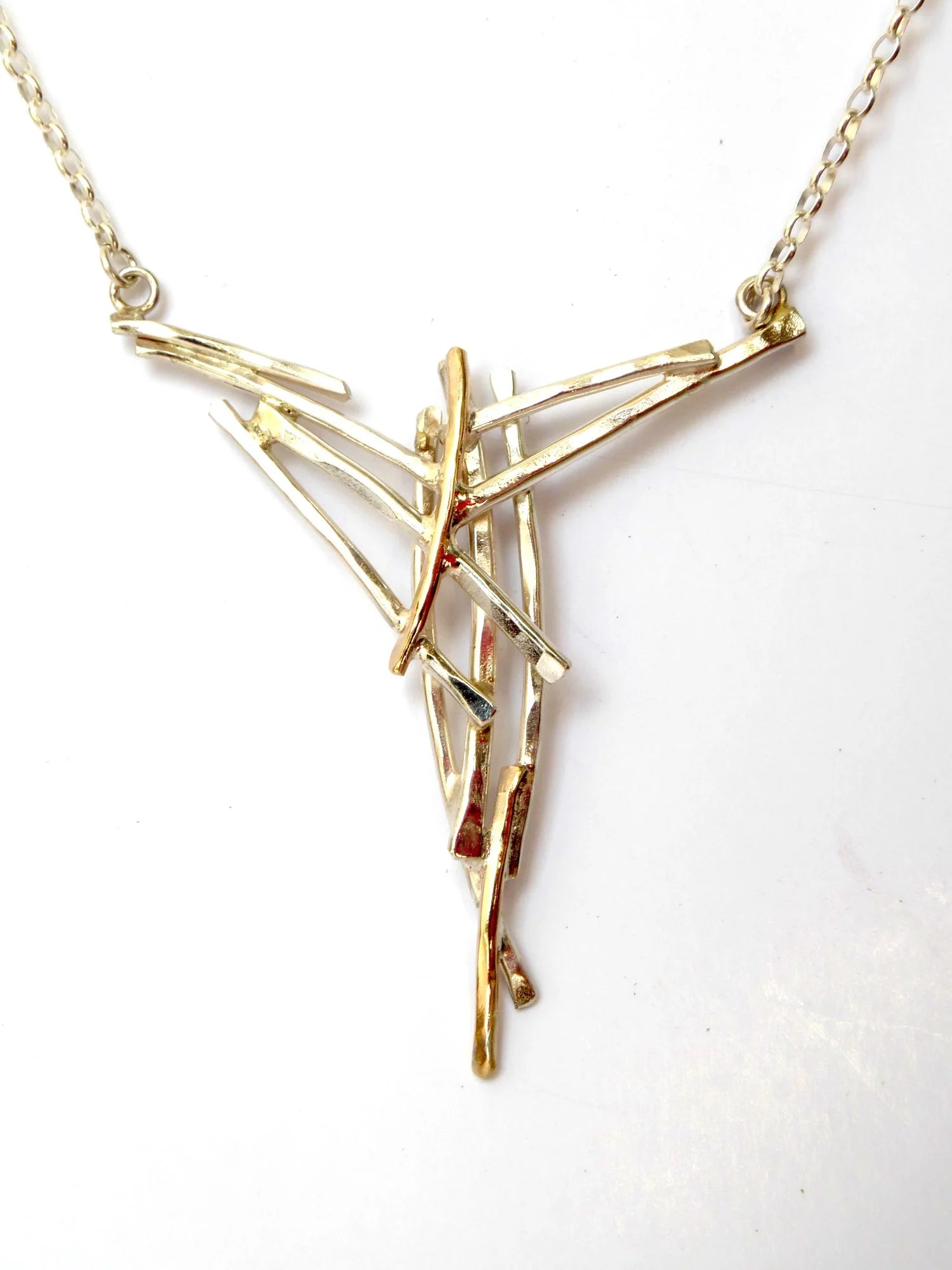 Close up of the Misu necklace - handmade silver and golg