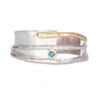 Organic silver and gold ring with a blue diamond