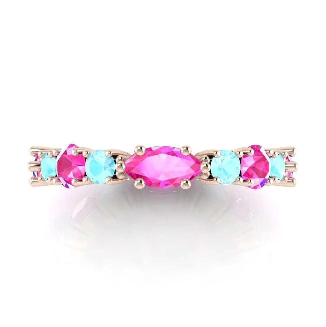 Close-up side view of the rose gold Fire and Ice ring highlighting the secure claw settings for the mixed-cut gemstones.