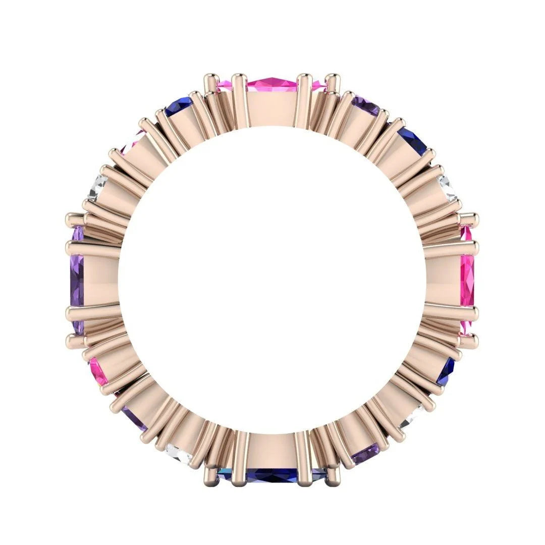 A through-finger view of the Allsorts multi-coloured ring showing the internal rose gold band and stone symmetry.