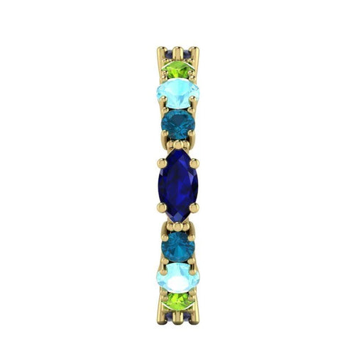 Close-up side view of the 18ct yellow gold Allsorts ring highlighting the blue/green gemstones for the multi-coloured gemstones.