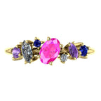 Top view of the 18ct yellow gold Atlantis Paradise ring featuring an asymmetrical cluster of pink, violet, and blue sapphires with diamonds.