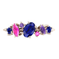 Front view of the 18ct rose gold Atlantis Paradise ring featuring an asymmetrical cluster of blue, pink, and violet sapphires.