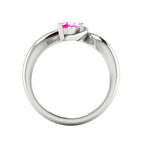 Enchanted pear pink sapphire ring in white gold, through-finger view showing clean interior band and low-set asymmetric profile