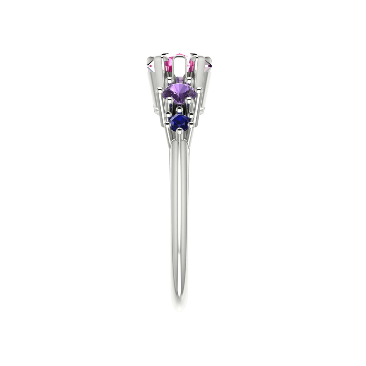 Pear shaped pink sapphire, violet sapphire and blue sapphire asymmetrical Comet engagement ring in 18ct white gold, side profile view showing asymmetric stone cascade