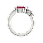 Pear shaped ruby, diamond and ruby accent asymmetrical Comet engagement ring in 18ct white gold, front view showing diamond and ruby accent detail
