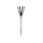 Pear shaped blue sapphire and diamond asymmetrical Comet engagement ring in 18ct white gold, side profile view