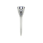 Pear shaped blue sapphire and two diamond asymmetrical Comet engagement ring in 18ct white gold, side profile view