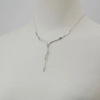 Dripping Silver Necklace on mannequin showing full lariat drop and drip pendant detail — sterling silver