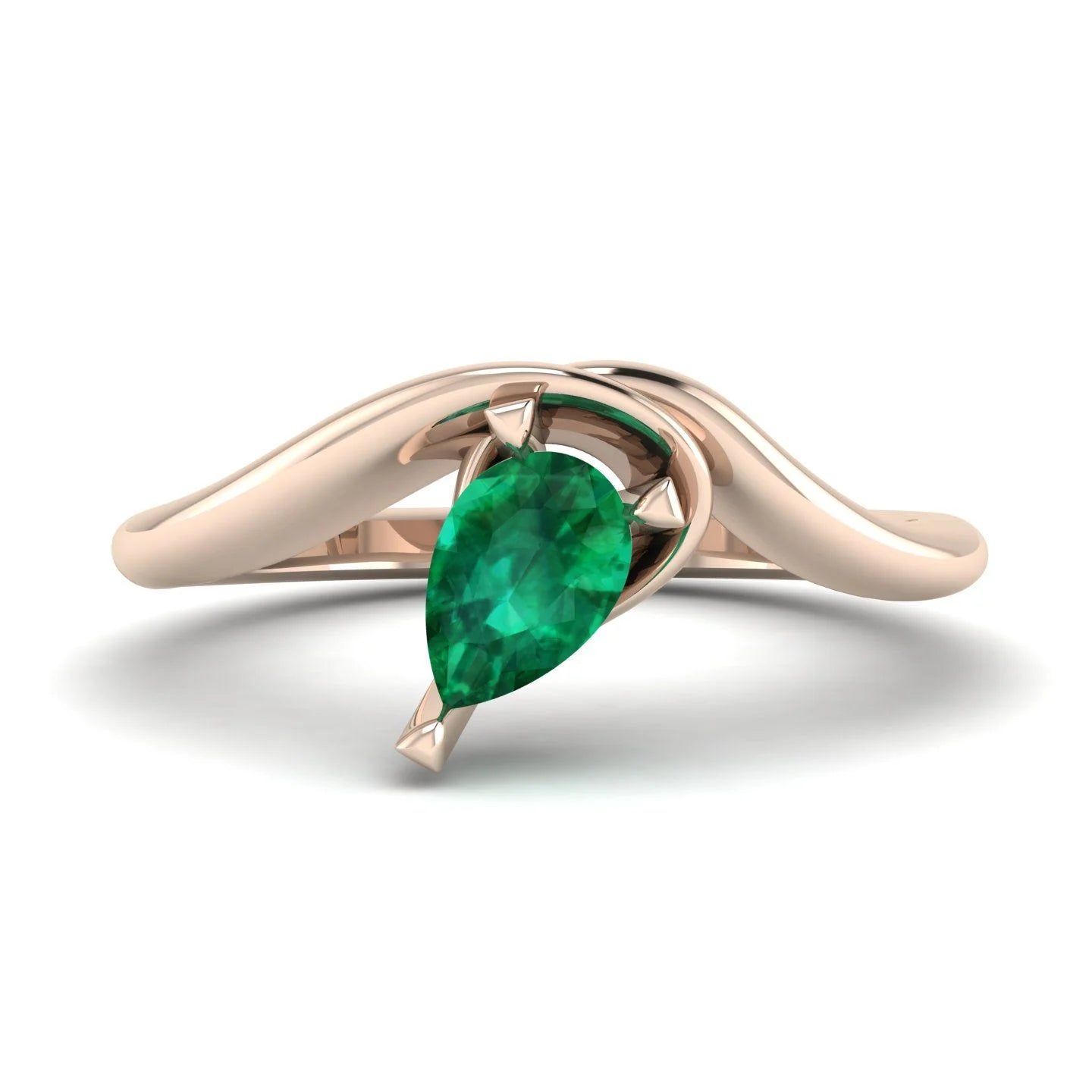 Enchanted pear-shaped lab-grown emerald asymmetrical solitaire engagement ring top-down view — showing asymmetric setting and pear stone orientation in rose gold by Nude Jewellery