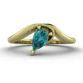 Enchanted pear-shaped teal sapphire asymmetrical solitaire engagement ring front view — ocean-toned teal sapphire in sculptural recycled 18ct yellow gold band by Nude Jewellery