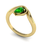 Enchanted pear-shaped tsavorite asymmetrical solitaire engagement ring three-quarter view — vivid forest-green tsavorite in sculptural recycled 18ct yellow gold band by Nude Jewellery