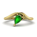 Enchanted pear-shaped tsavorite asymmetrical solitaire engagement ring top-down view — showing asymmetric setting and pear stone orientation in yellow gold by Nude Jewellery
