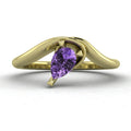 Enchanted pear-shaped violet sapphire asymmetrical solitaire engagement ring front view — ethereal lavender sapphire in sculptural recycled 18ct yellow gold band by Nude Jewellery